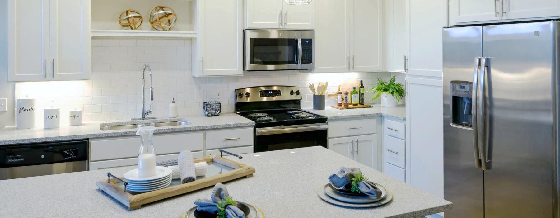 a kitchen with white cabinets