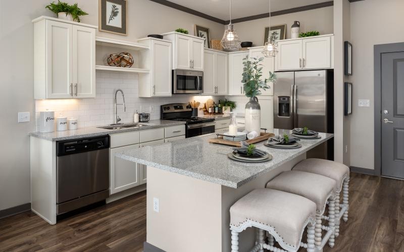 a kitchen with white cabinets