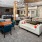 a living room with a couch and chairs